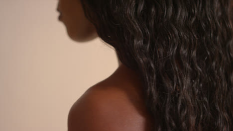 Studio-Beauty-Shot-Of-Woman-With-Long-Hair-Against-Neutral-Background-Viewed-From-Behind-2